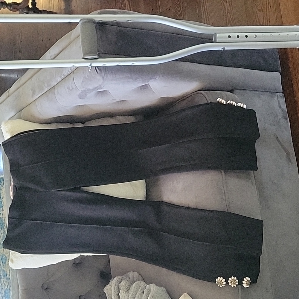 Cropped black dress pant with bead detail.on bottom